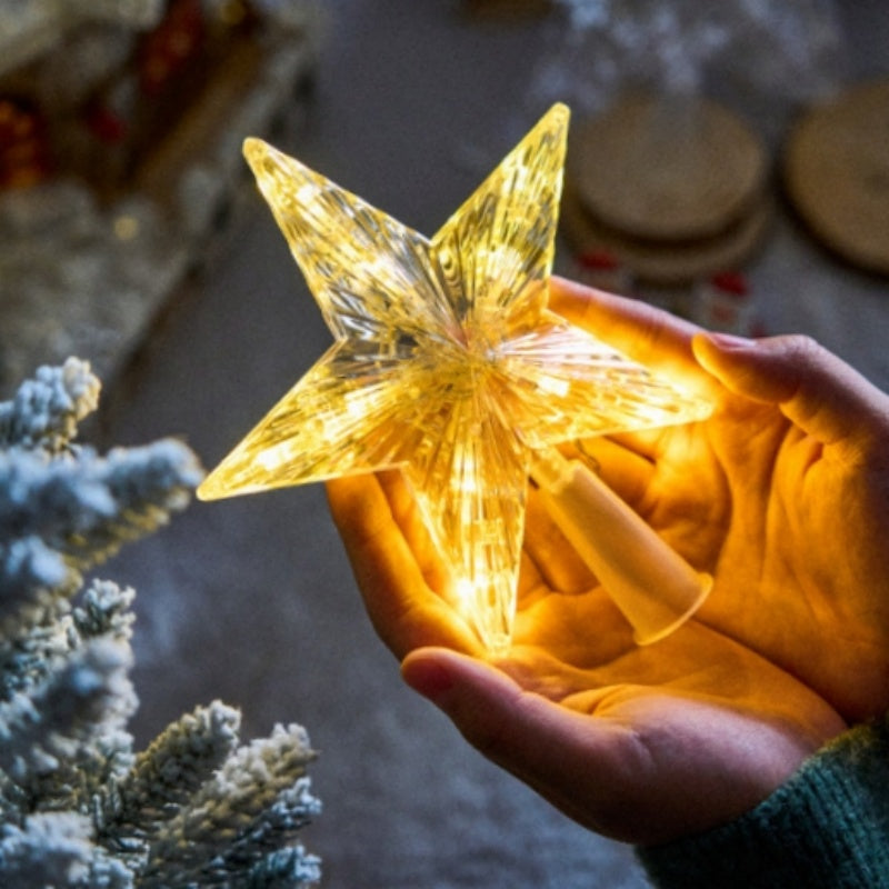 The Top Star Of The Christmas Tree Is Decorated With A Five-Pointed Star Lamp