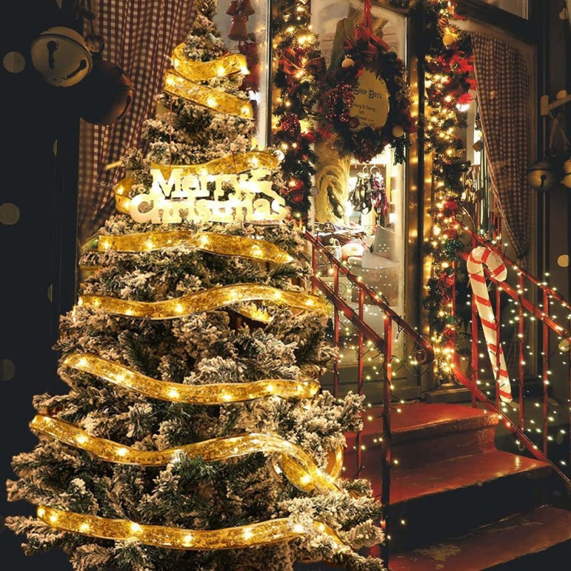 The Christmas Tree Is Decorated With Ribbons And Colorful Lights