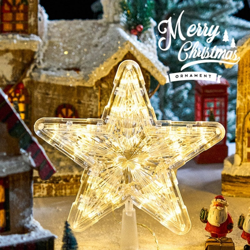 The Top Star Of The Christmas Tree Is Decorated With A Five-Pointed Star Lamp