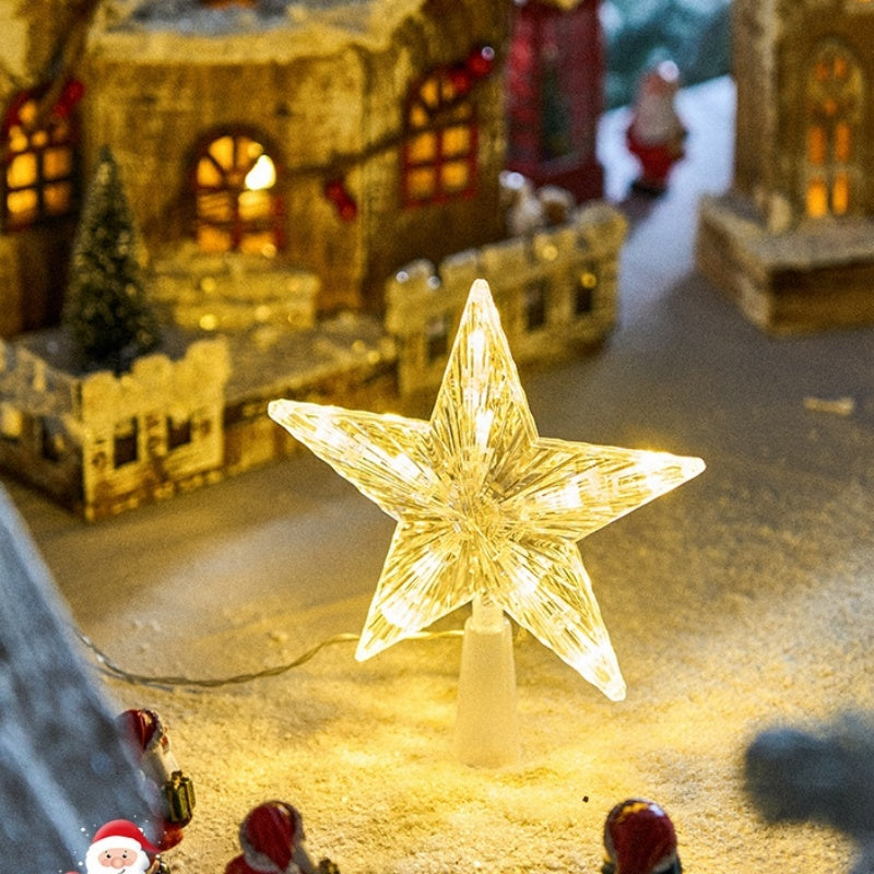 The Top Star Of The Christmas Tree Is Decorated With A Five-Pointed Star Lamp