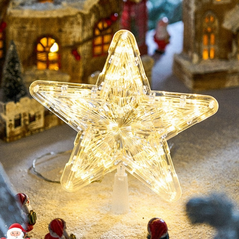 The Top Star Of The Christmas Tree Is Decorated With A Five-Pointed Star Lamp