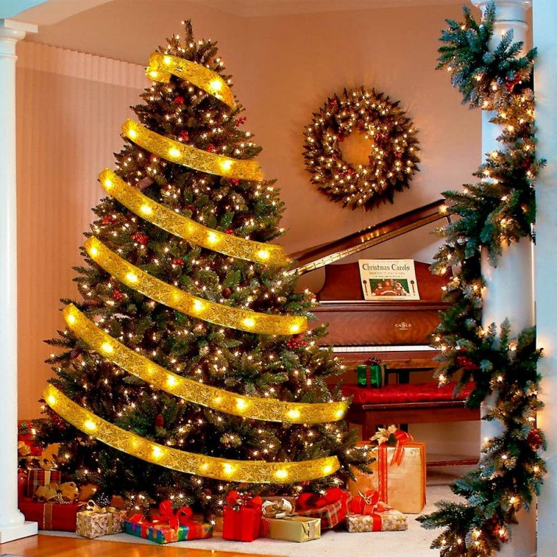 The Christmas Tree Is Decorated With Ribbons And Colorful Lights