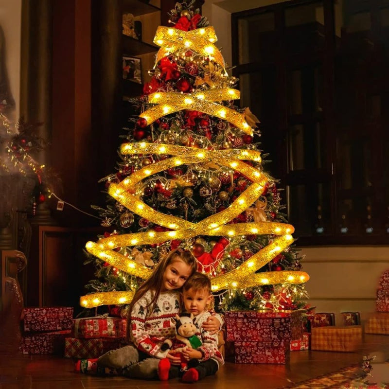 The Christmas Tree Is Decorated With Ribbons And Colorful Lights