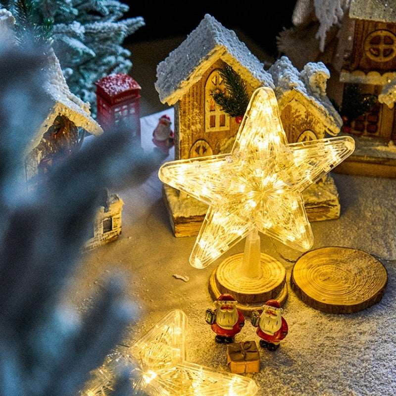 The Top Star Of The Christmas Tree Is Decorated With A Five-Pointed Star Lamp